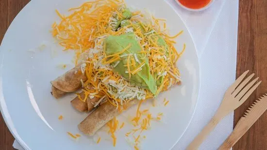 Three Rolled Tacos with Guacamole and Cheese