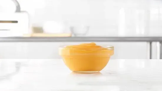 Cup of Cheddar Sauce