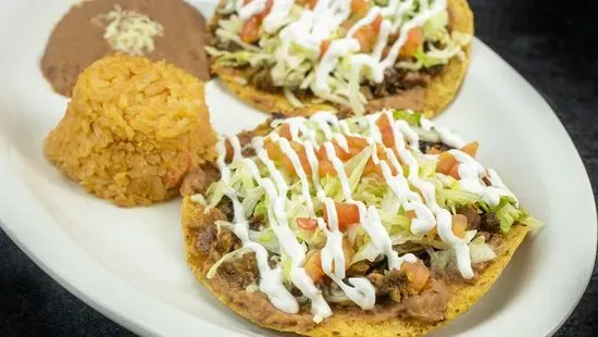 Dos Tostadas con Arroz y Frijoles