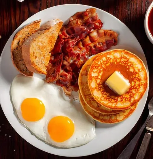 2 Eggs, with Pancakes or French Toast and Choice of Meat