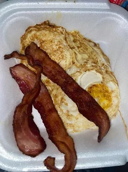 Breakfast Special —- 2 eggs, 2 pancakes, 3 pieces of bacon