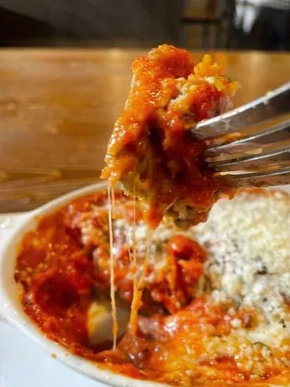 Eggplant Parmesan  (Served w/ side salad & garlic bread)