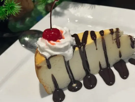 Cheese Cake with chocolate syrup on top