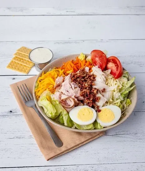Chef & Bacon Salad (Ham, Turkey, Bacon, Lettuce, Eggs, Carrots, Tomatoes, Swis & Cheddar Cheese) served with dressing and crackers
