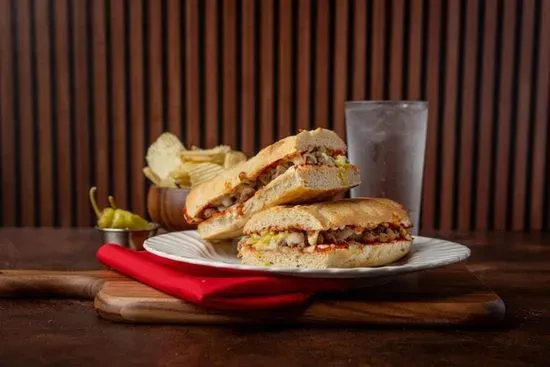 Hamburger Stromboli (Hamburger topped with our Pizza Sauce, Onions, Green Peppers, Chopped Pepperoncini, and our Mozzarella & Provolone on our homemade bread), chips, and a pepperoncini pepper