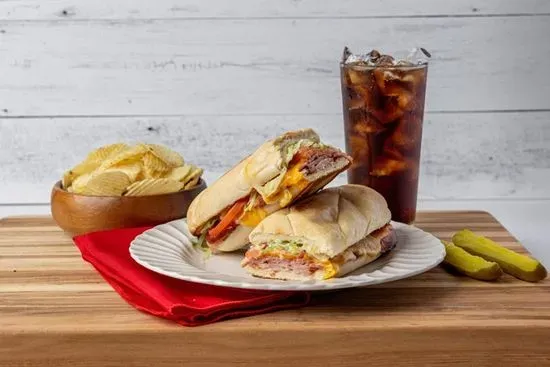 The Extra Sandwich (Deli Ham, Canadian Bacon, Salami, Lettuce, Tomato, Mayonnaise, Swiss & Cheddar) with chips and a pickle Kids Menu