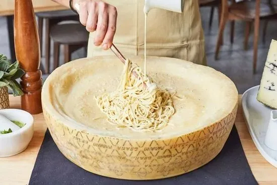 CHEESE WHEEL PASTA IN HOUSE ALFREDO