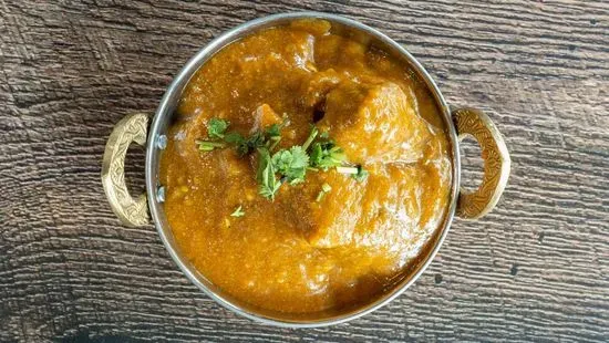 Goat Curry Dinner includes (Vegetable, Dal, Rice & Naan )