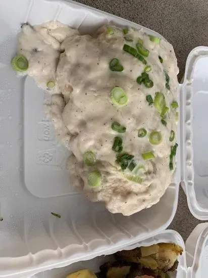 Cowboy Breakfast Burrito Topped with Country Gravy