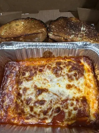 Meat Manicotti w/ garlic bread