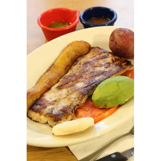 Grilled Pork Steak (10oz) from Mondongo's Restaurante