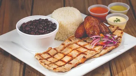 7. 1/2 lb grilled pork with rice, beans, plantains and soda