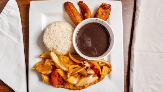 8. ½ Lb. fish fillet with rice, beans, plantains and soda