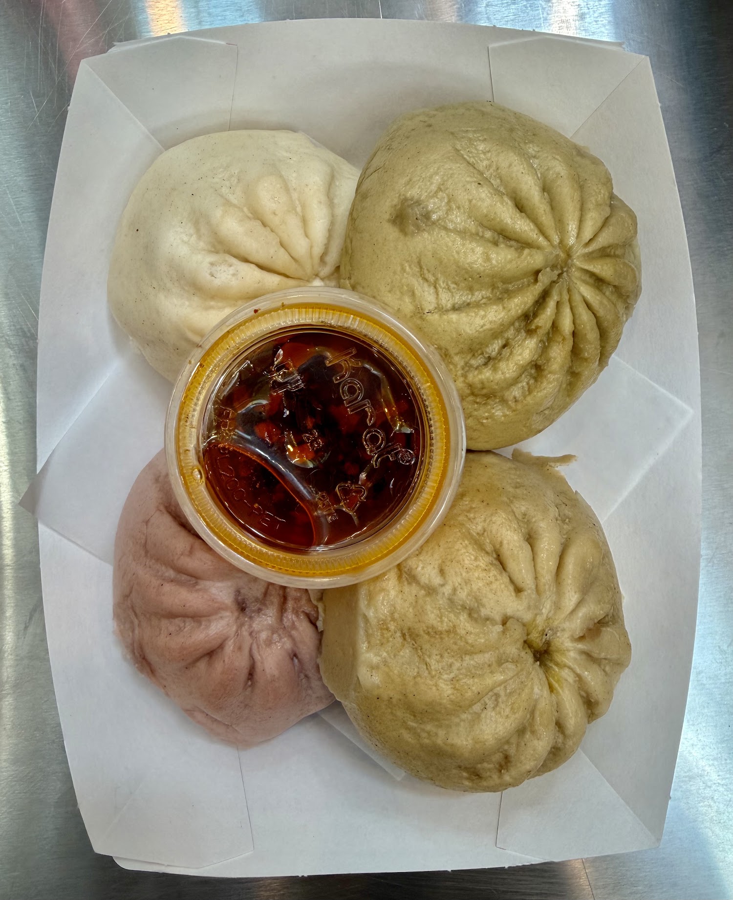 Colorful bao served with chili oil