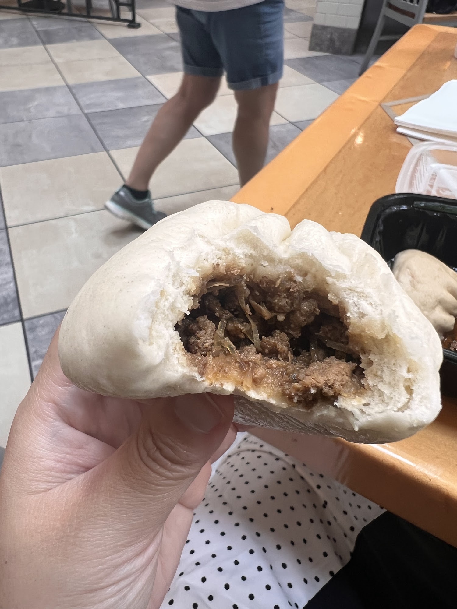 Beef bao torn open to show the filling